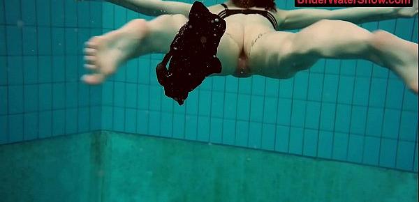  Tattooed baby swirls underwater